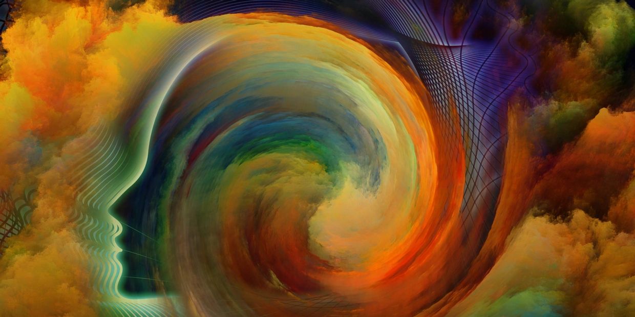 Abstract swirls of color forming a silhouette of a human face in profile.