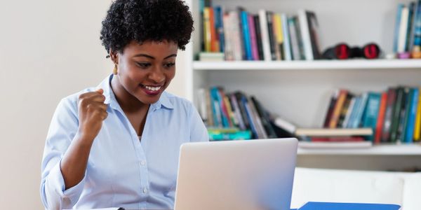 black woman sitting at laptop