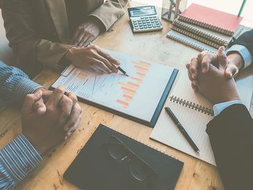 Business people in a private meeting discussing the results of the company