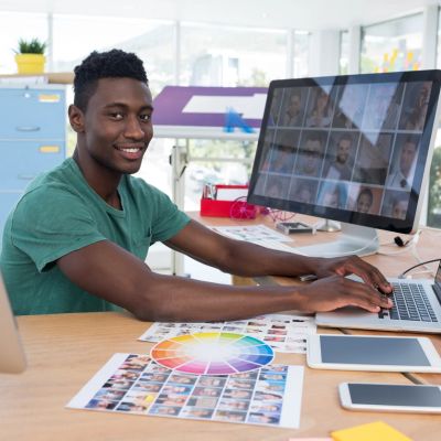 Man working on graphic design at computer.