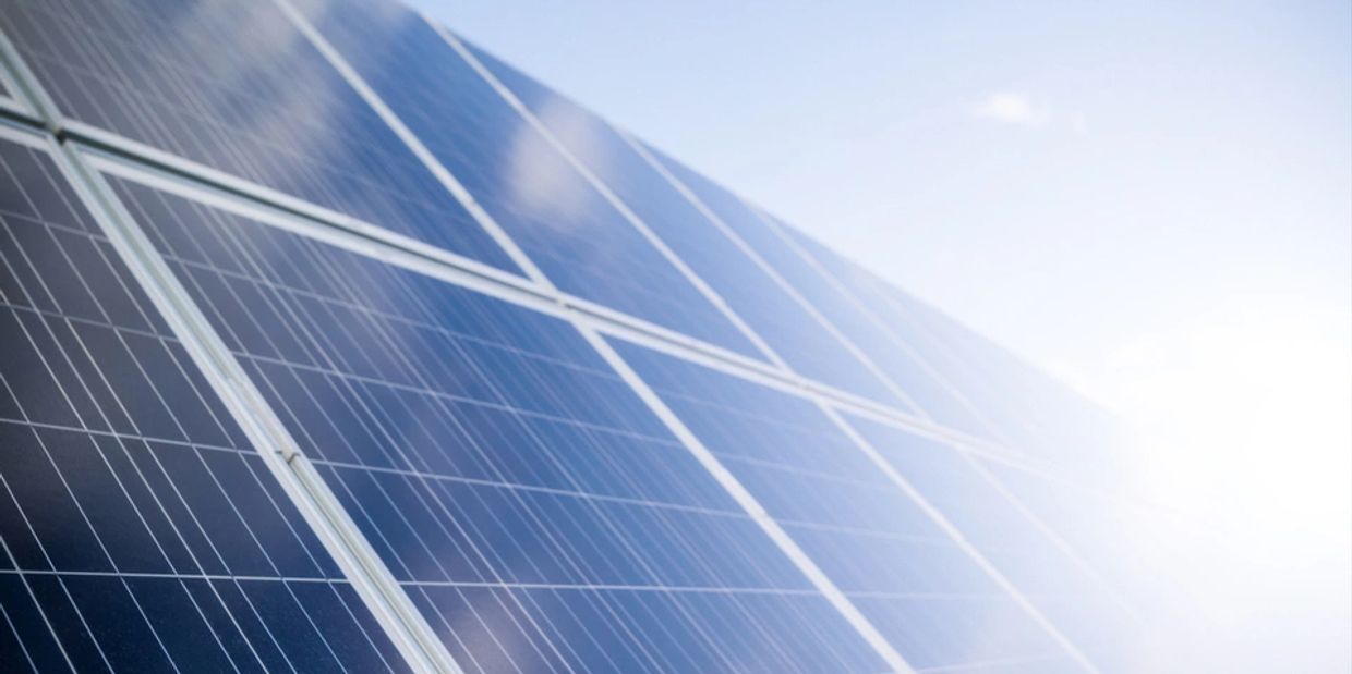 Close-up of solar panels reflecting sunlight.