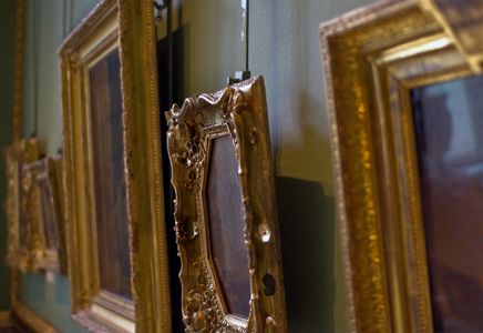 gilded frames in an art gallery