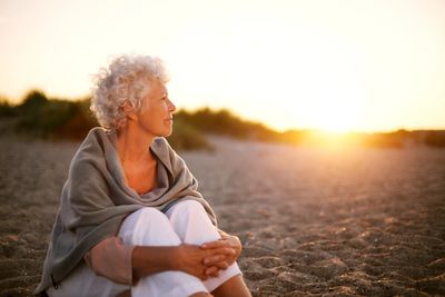 senior sitting alone
senior check in service
call seniors  who are isolated
isolation and loneliness