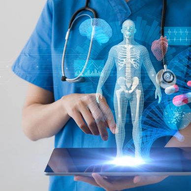 Medical professional interacting with a holographic human anatomy display.