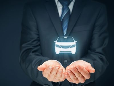 Protecting Your Investment |Hands Holding a Car Symbolizing Vehicle Warranty and Insurance Services