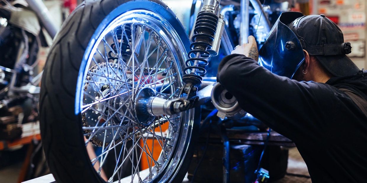 Motorcycle being worked on by mechanic