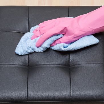Wiping and sanitizing furniture. Janitorial Services