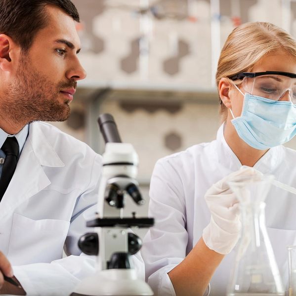Scientists conducting experiments in a lab.