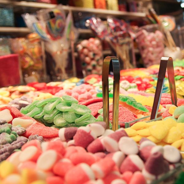 Colorful assorted gummy candies in a candy shop display.