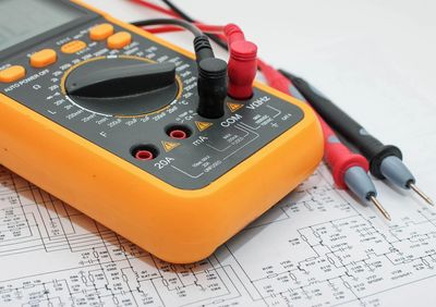 A digital Multimeter used for testing electrical circuits and components.