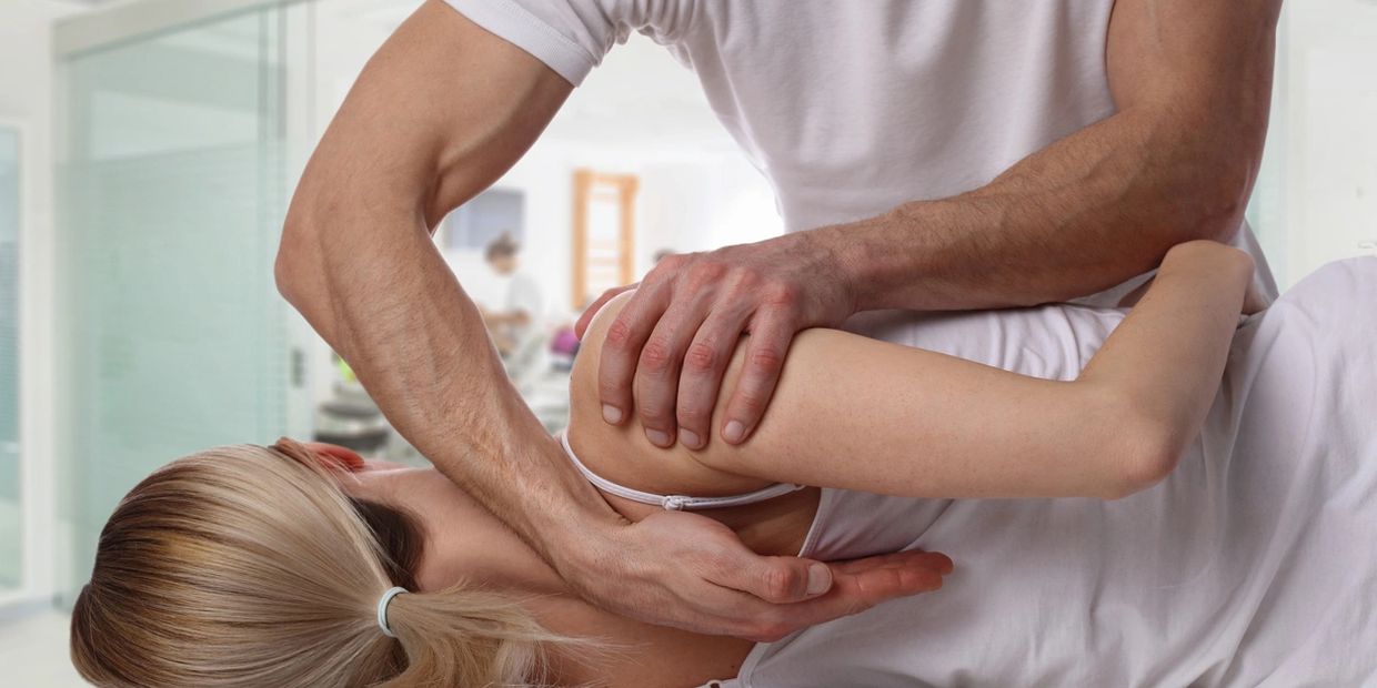 Patient being adjusted by chiropractor