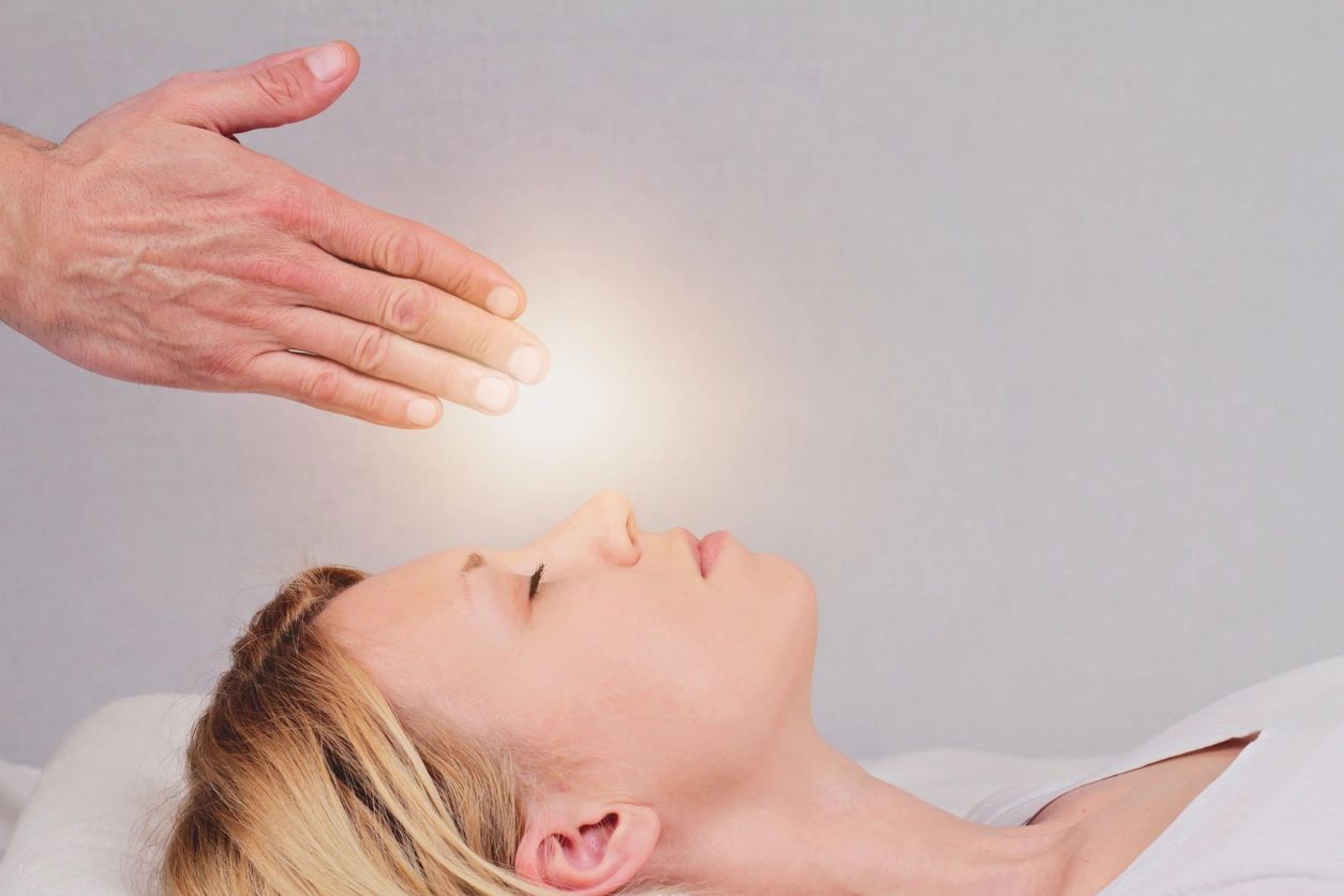 Energy Healing and Reiki practices helping individual heal from trauma, pain, blockages.