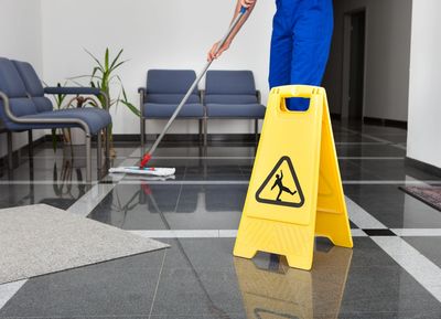 Image of professional janitor detail cleaning business floor - Dayton, OH