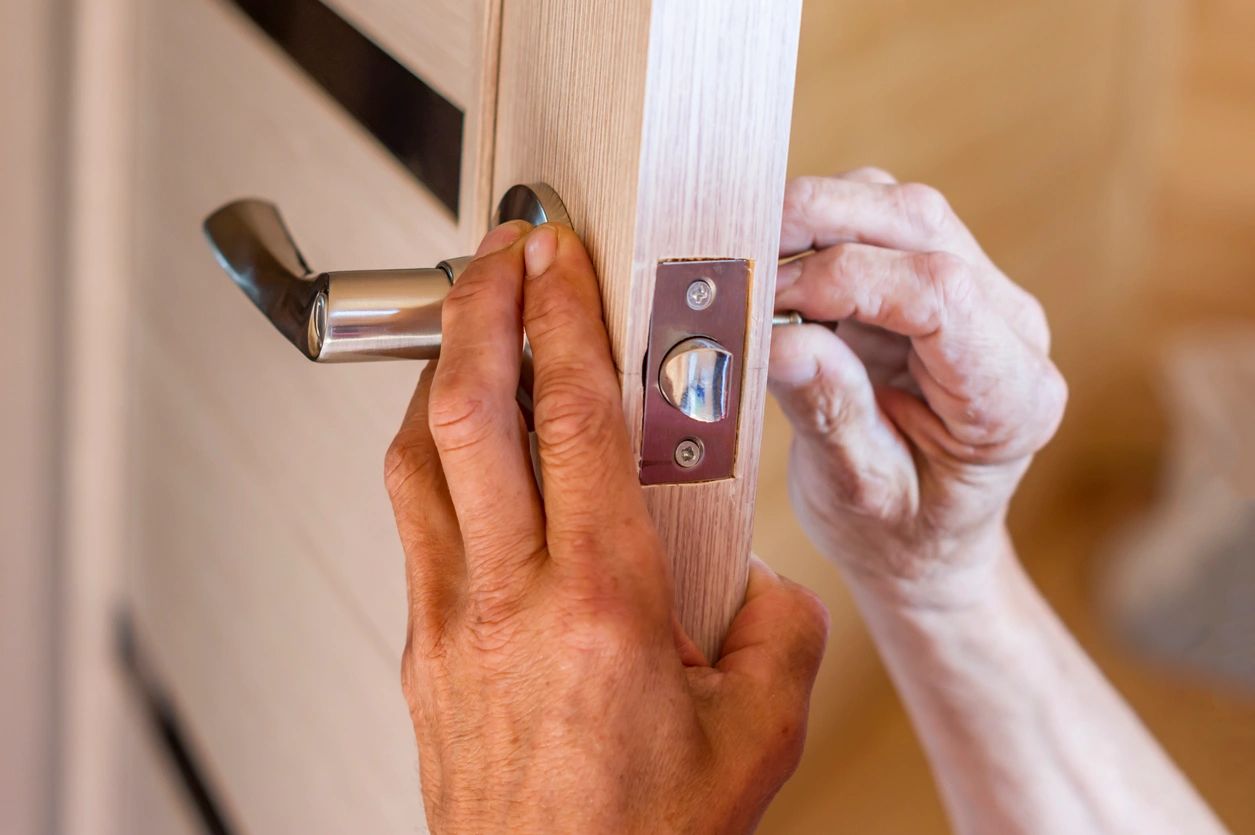 A person repairing a door