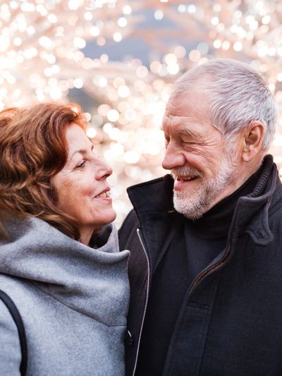 ageing couple smiling happily at one another because they have caring hearts home healthcare