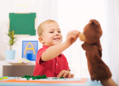 Toddler engaging in play-based early intervention ABA therapy in Vista, California
