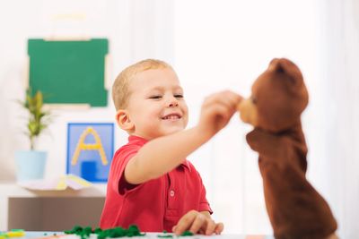 Toddler engaging in play-based early intervention ABA therapy in Escondido, California