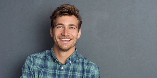 A man smiles at the camera, likely having benefited from individual therapy at Southside Counseling.