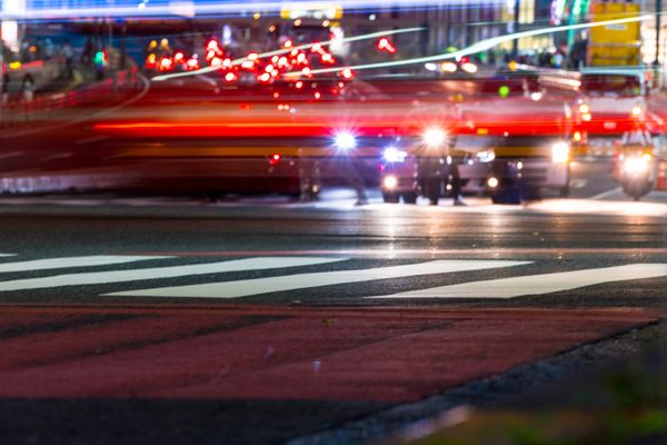 Busy street at night at a crossing
