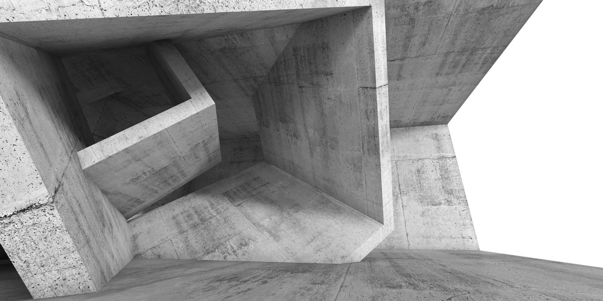 Abstract concrete geometric structure with sharp angles and clean lines.