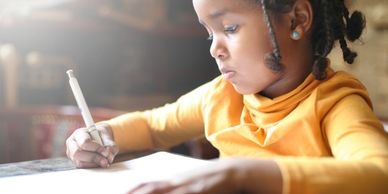 (Not me in the picture but I like this little stock photo sista. I was a little writing child too.)