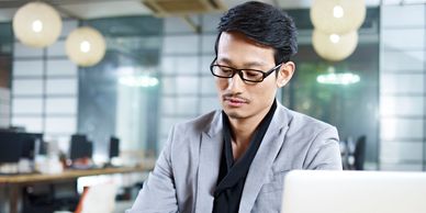 Chinese employee working in an office.
