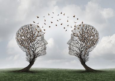 Two tree-shaped human heads connected by birds flying between them.