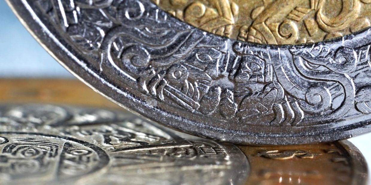Close-up of intricately designed coins with detailed engravings.