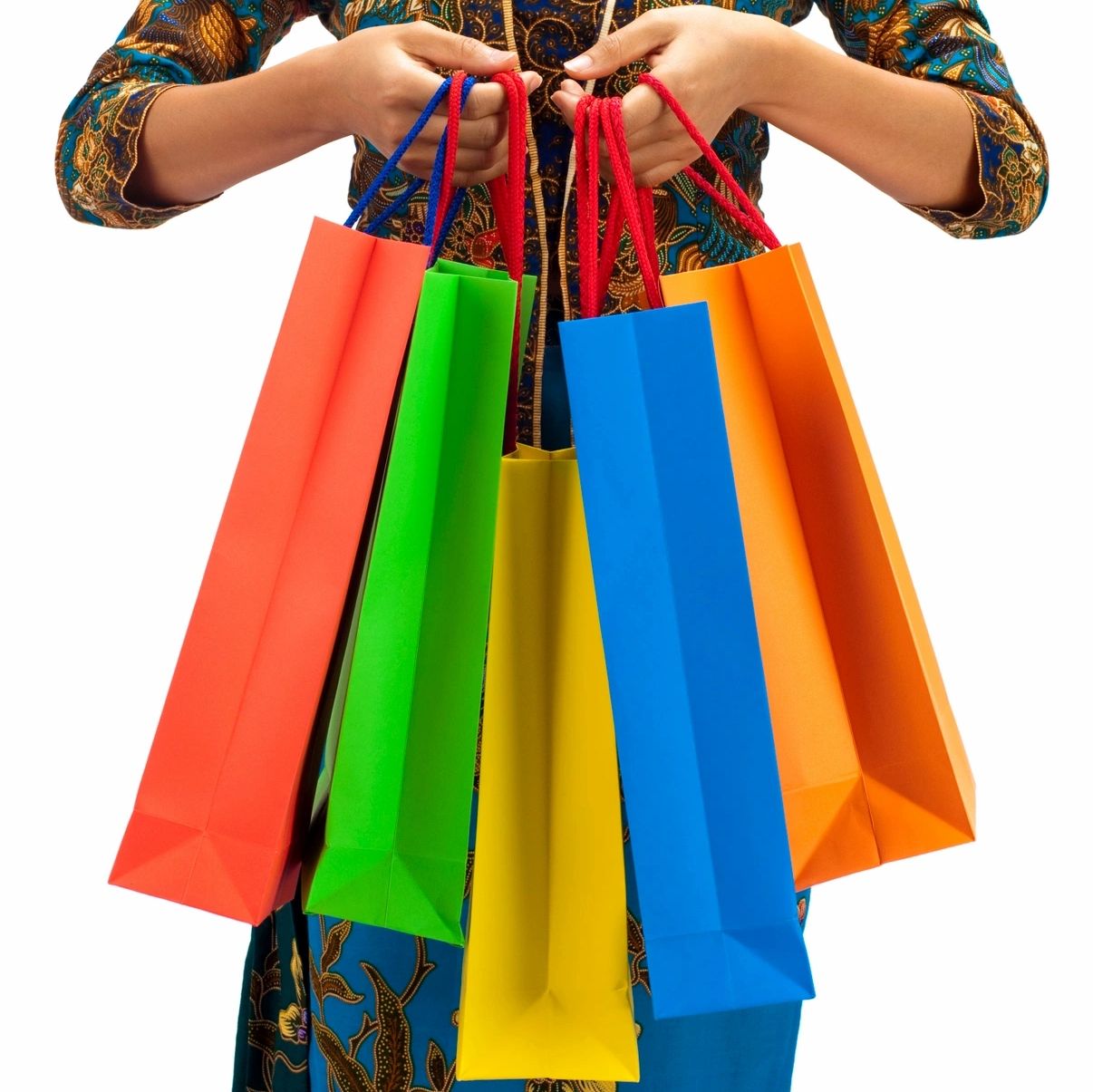 Person holding shopping bags after going shopping