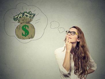 A woman imagines a bag of money with dollar bills.