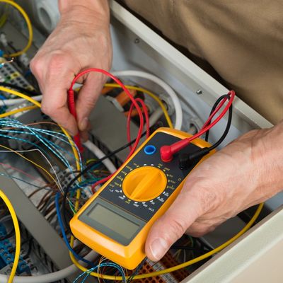 electrician testing the current of wires