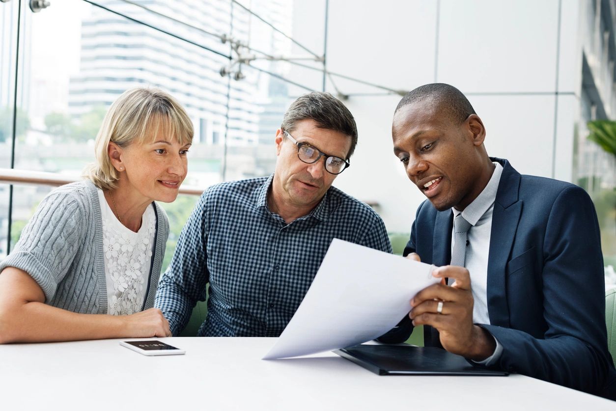 A real estate professional shows the buyers housing data for the home they are touring.