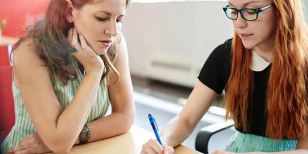 Tutor working with student.