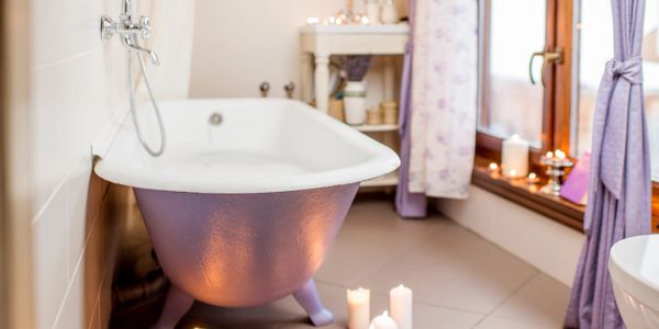 Gorgeous bathroom with clawfoot tub and candles. ABC Plumbing services available 817-427-3222