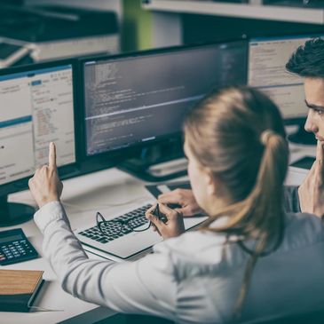 Woman at a computer in a professional business setting