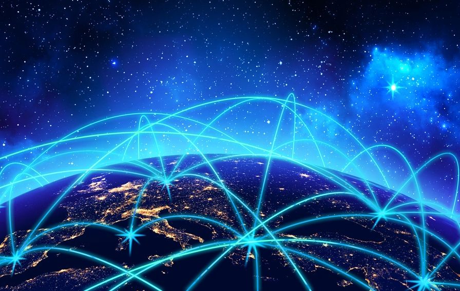 Digital network connections spanning the globe at night.