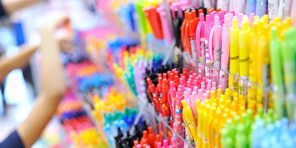 Rows of colorful pens neatly displayed in a store.