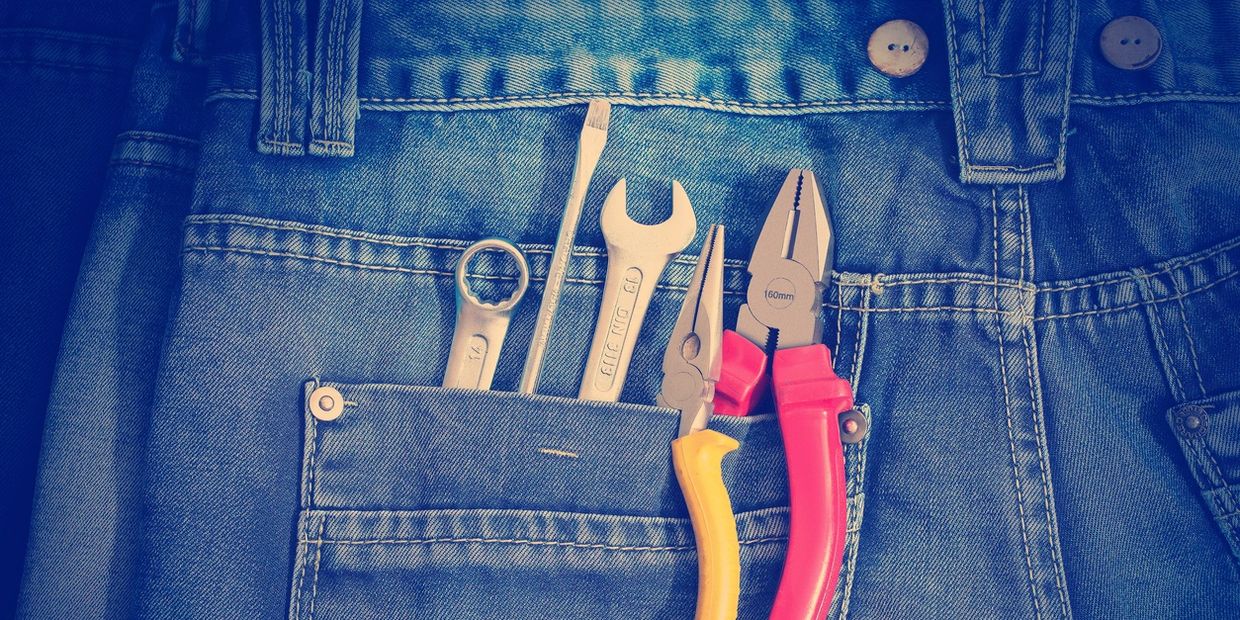 tools in back pocket of jeans