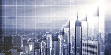 City skyline with financial graph overlay showing growth.