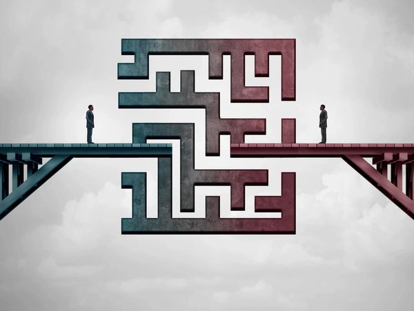 Two people face each other with a maze bridge between them.