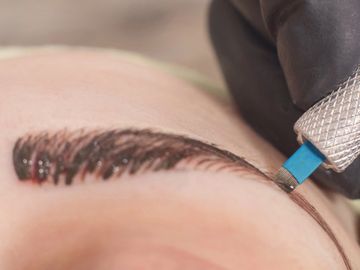 Eyebrow being filled in
