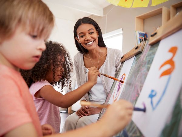 Children painting in daycare