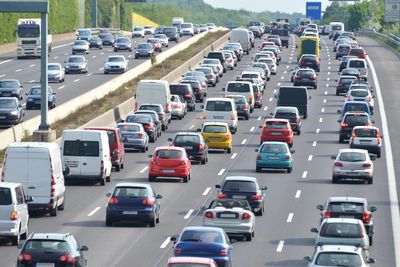 Heavy traffic congestion on a multi-lane highway during daytime.