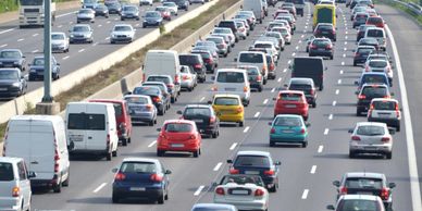 Image of a highway with bumper to bumper traffic 