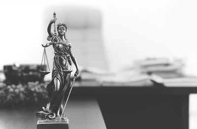 Statue of lady justice with scales and sword image for Lauren S. Petkin family law and mediation