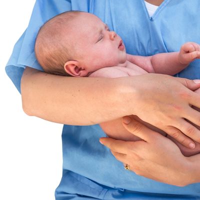 An OBGYN doctor holding a baby near Mundelein, IL