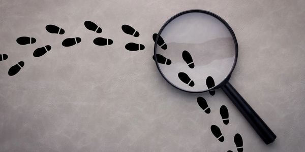 Footprints with magnifying glass