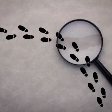 Footprints with magnifying glass