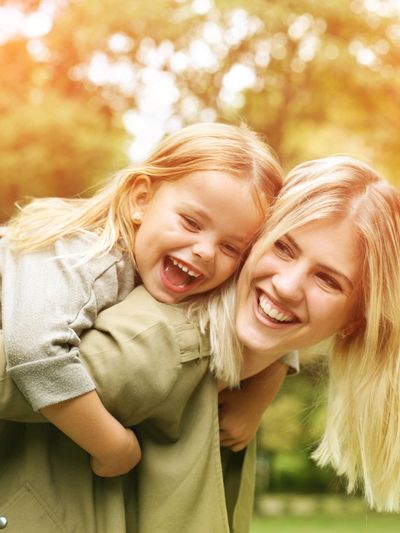 A Denver Women and her daughter happy after finding relief from trauma and anxiety through therapy