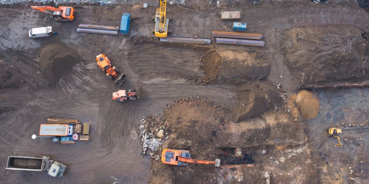 Aerial view of a construction site with heavy machinery.
